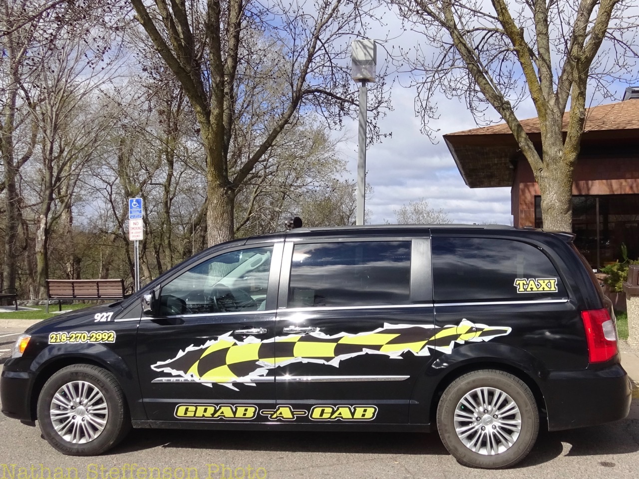 black grab-a-cab Taxi (left)
