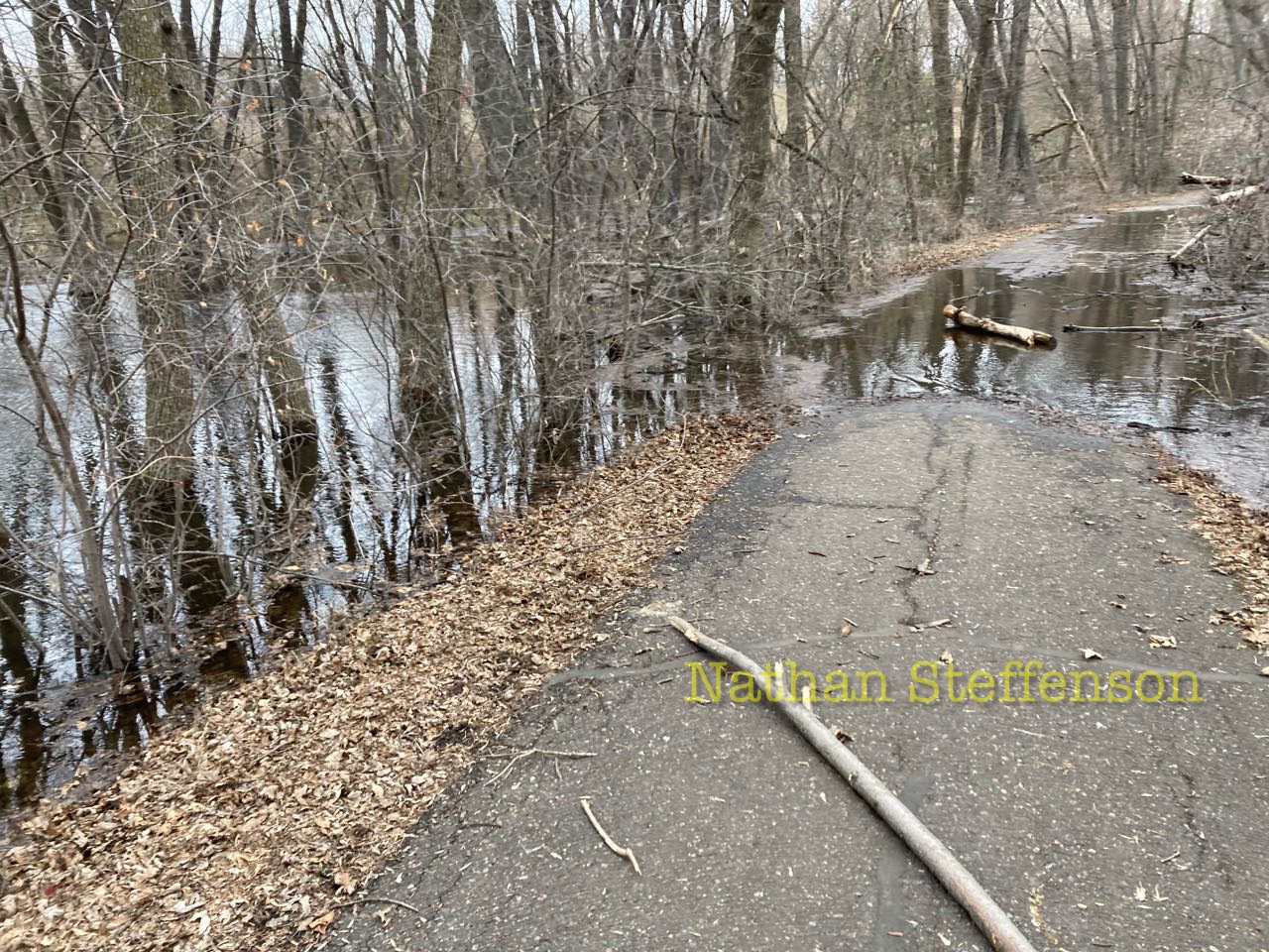 boom lake flowing over trail